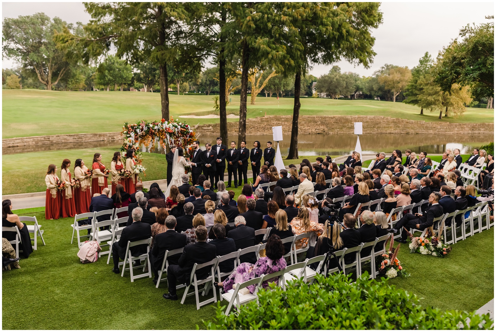 A view from above of a wedding ceremony on a golf course