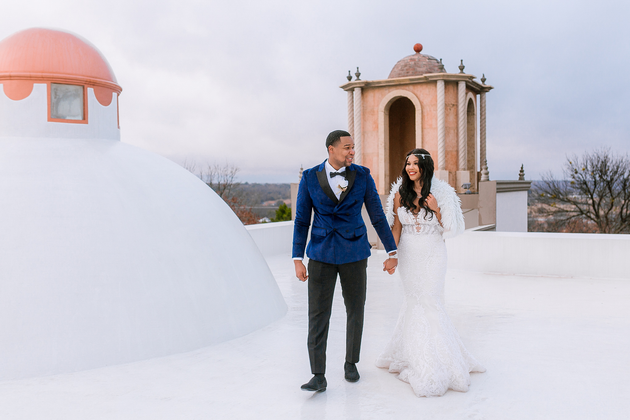 Bride and groom walking at the terrace of the beautiful Stoney Ridge Villa