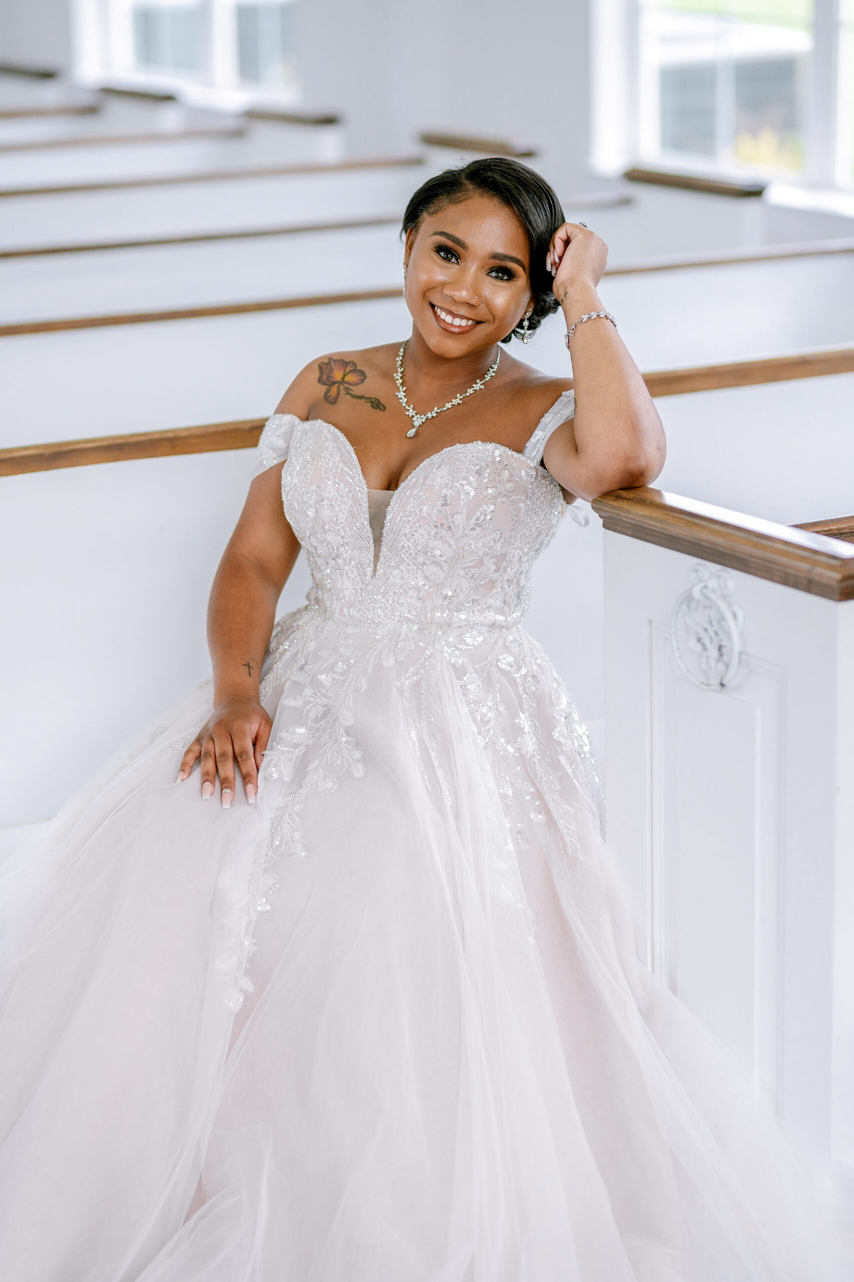 A bride sitting inside a chapel, smiling