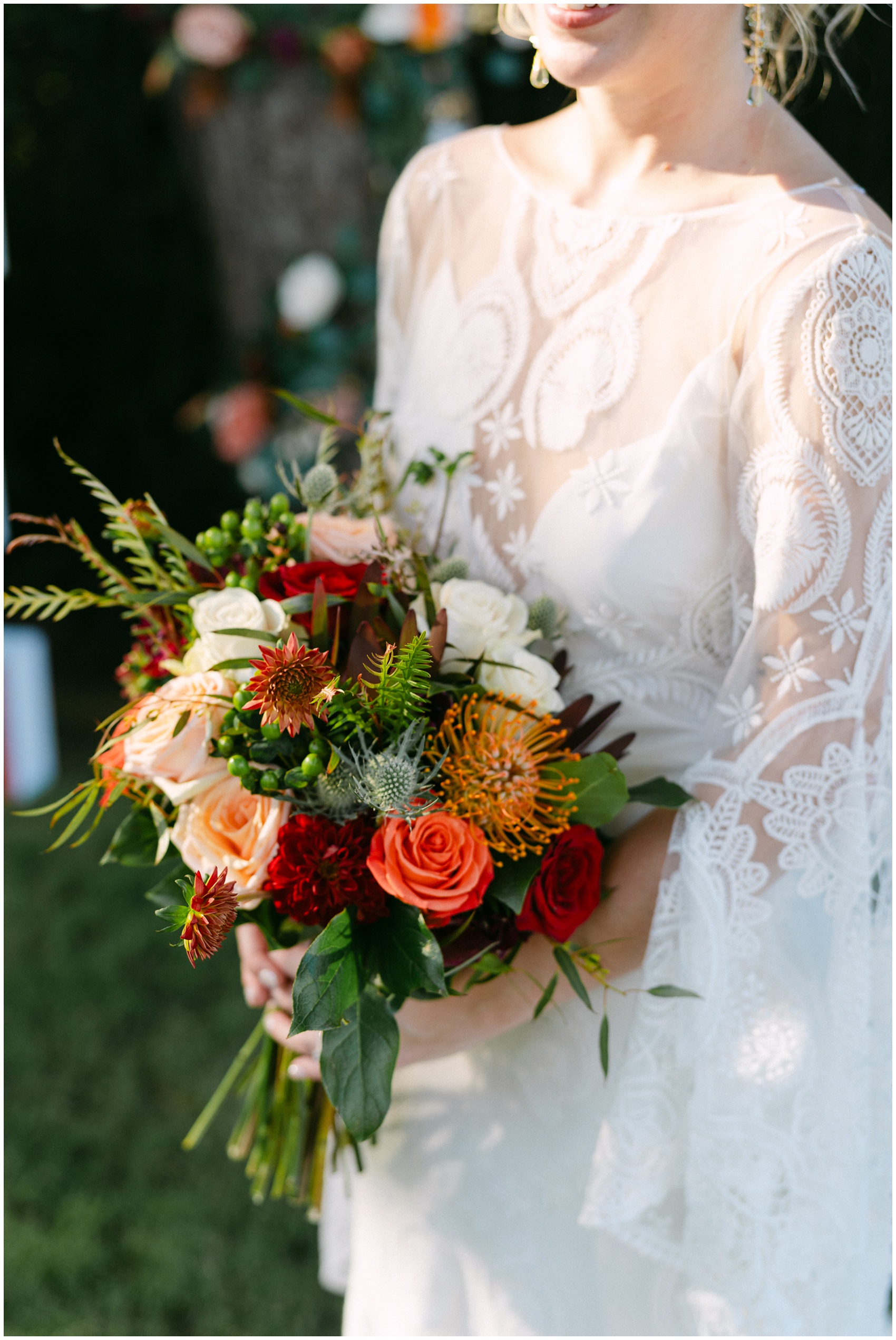 Details of a b rides colorful and vibrant bouquet in her hands at sunset