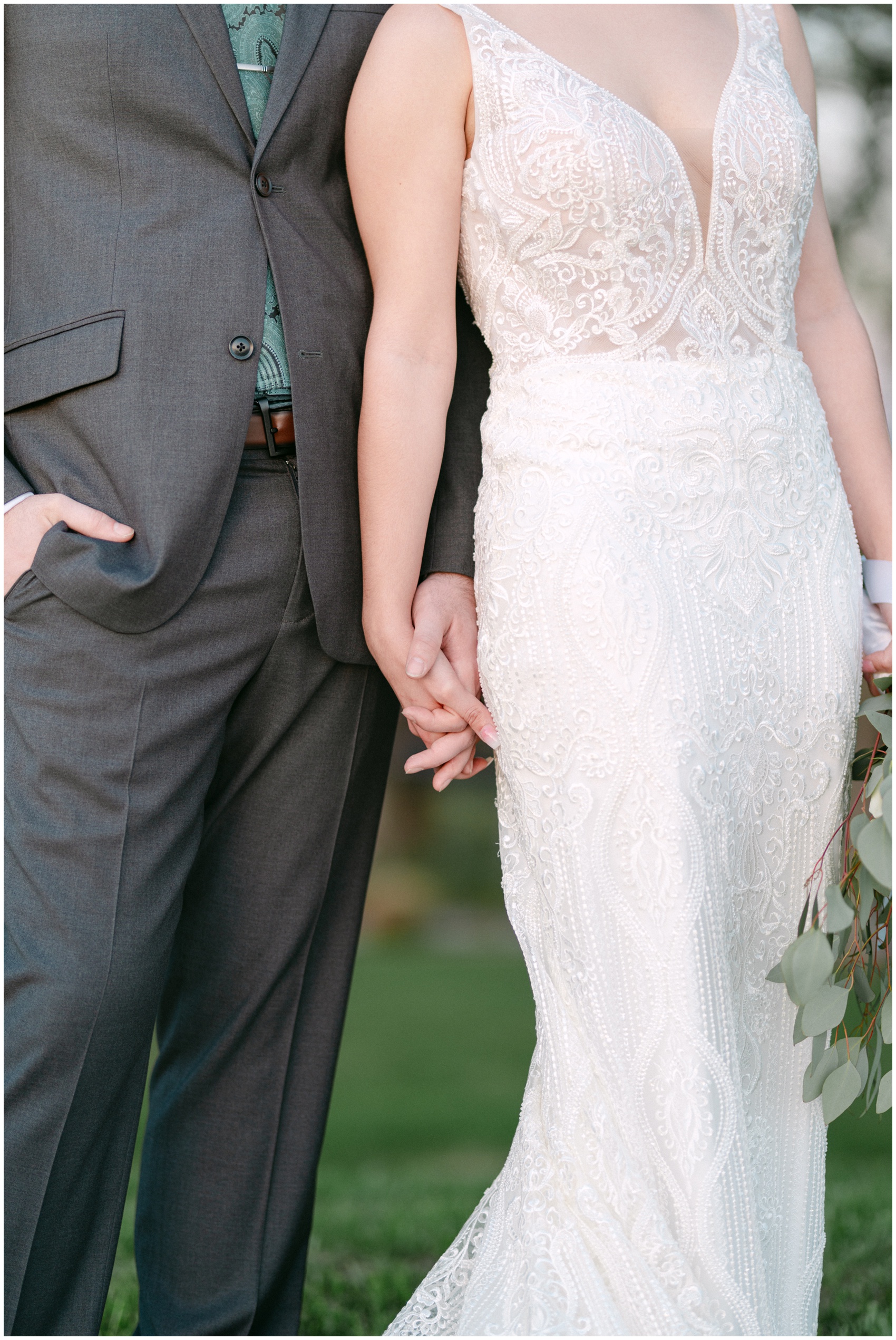 Details of newlyweds standing together and holding hands at their Rosewood Mansion On Turtle Creek Wedding