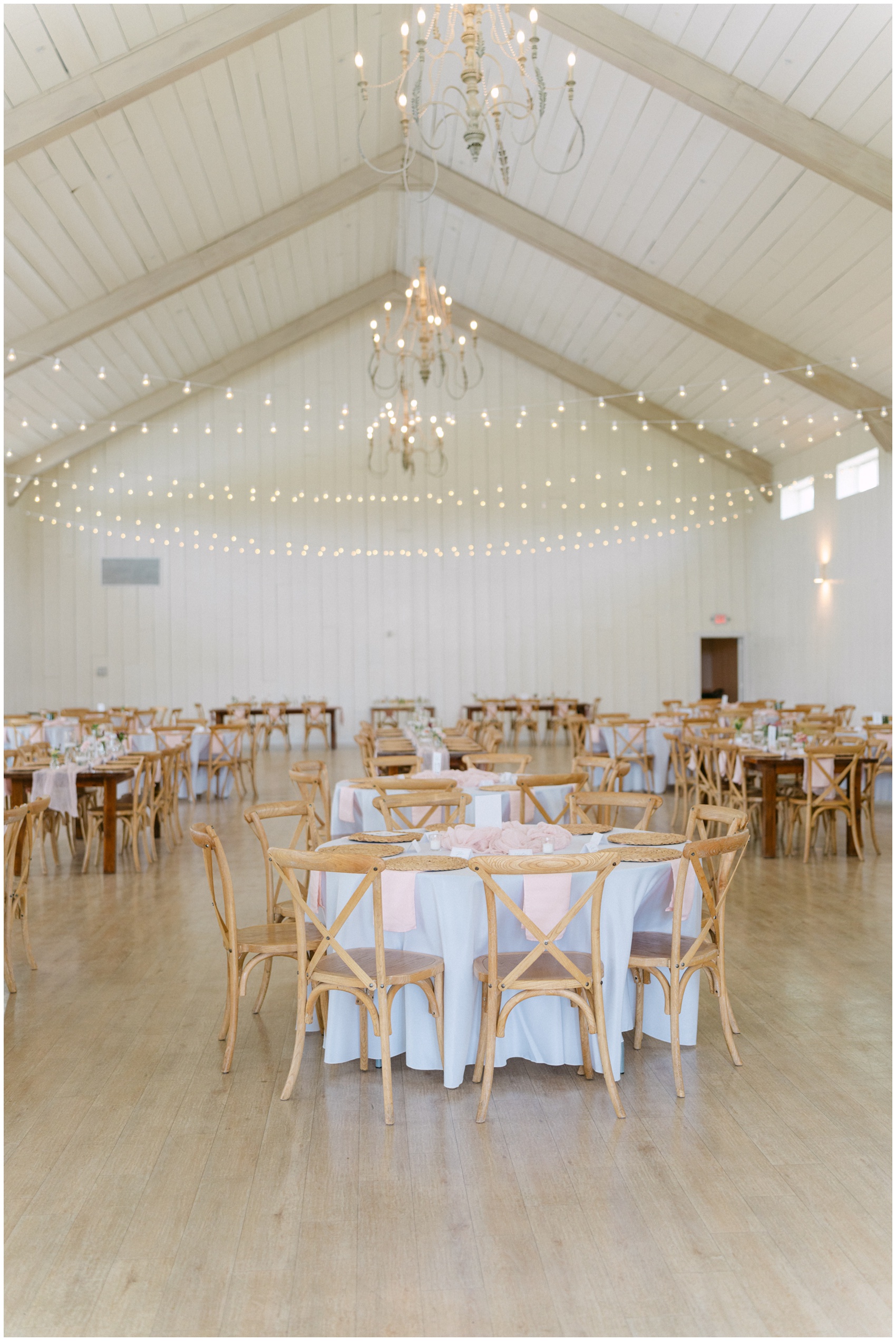 Details of a wedding reception set up with blue and pink linen at The Grand Ivory Wedding Venue