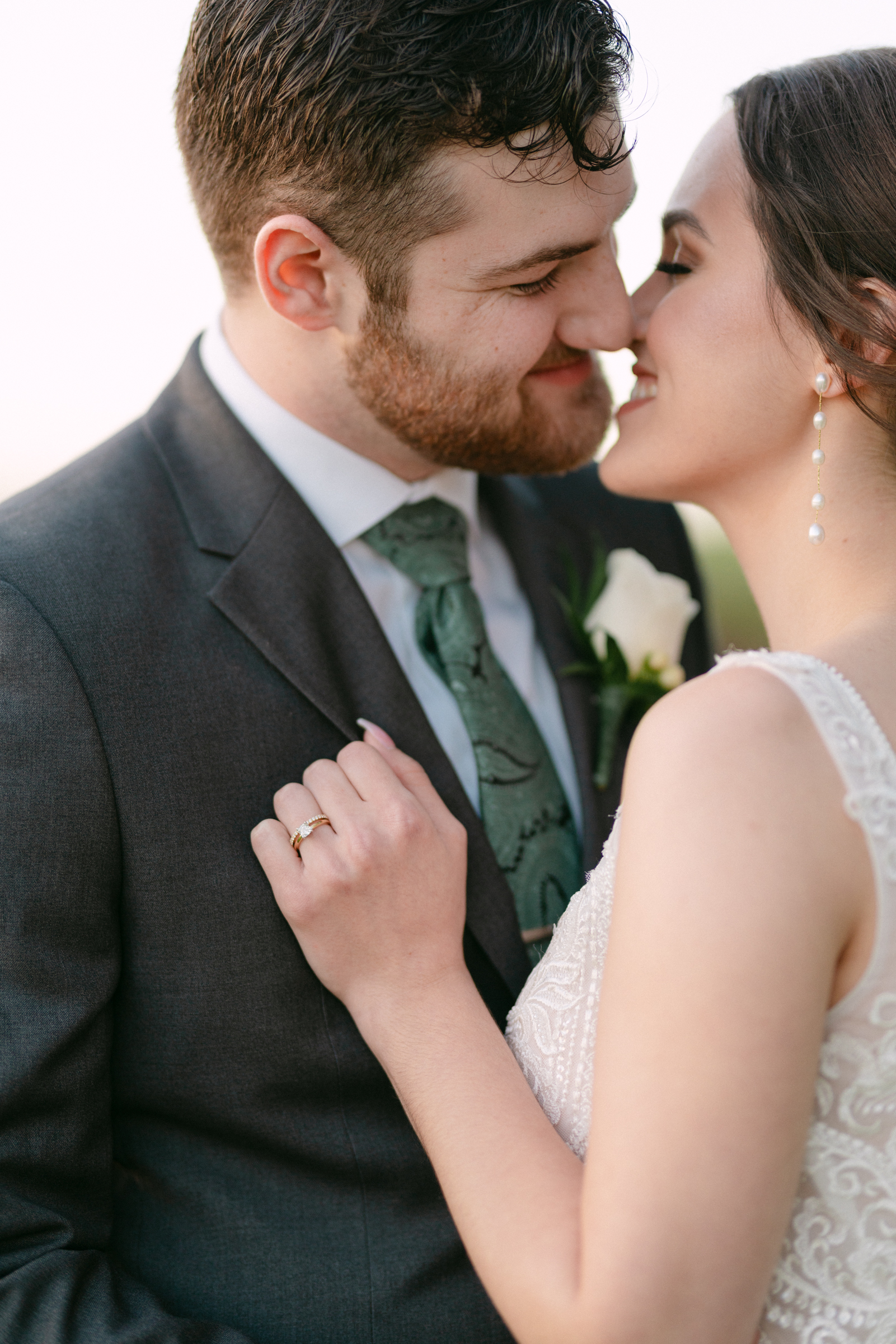 A bride and groom lean in for a happy kiss during their day at The Union House Wedding venue