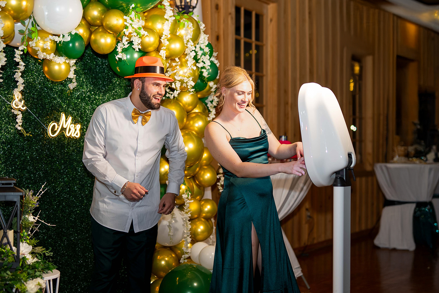 Bridal party having fun and playing with a DFW Photo Booth at a wedding