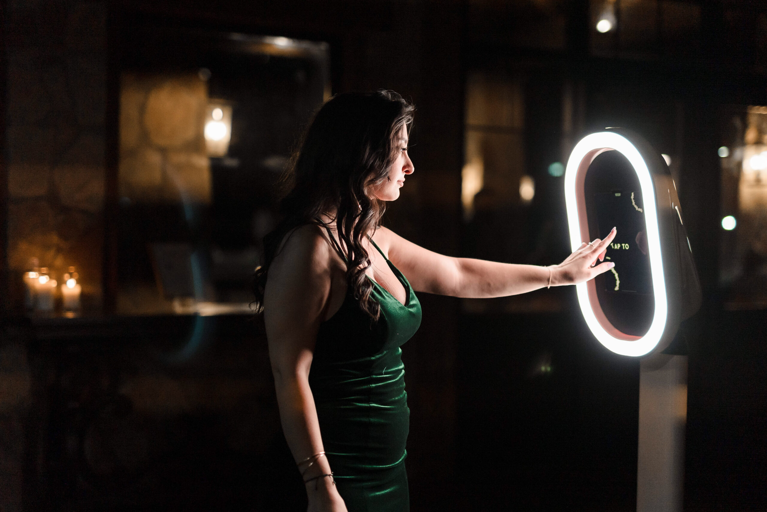 A young girl playing with a DFW Photo Booth at a wedding