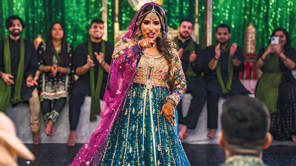 Bride dancing during a cultural wedding reception captured by Mentopia Weddings